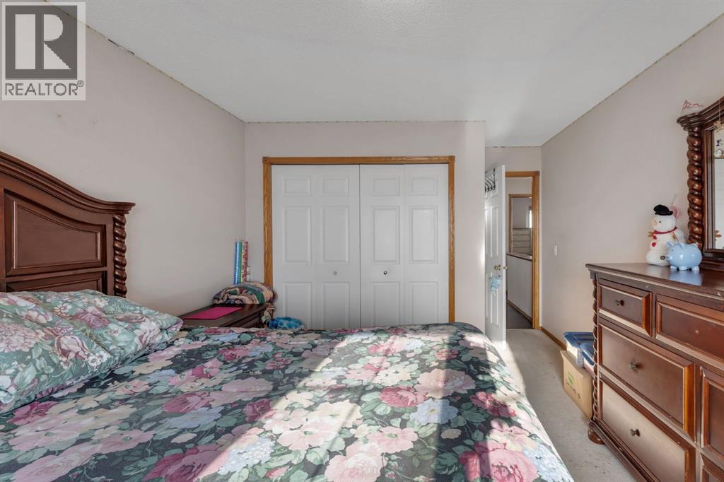 717 Coral Springs Boulevard Ne, Calgary, AB - Indoor Photo Showing Bedroom