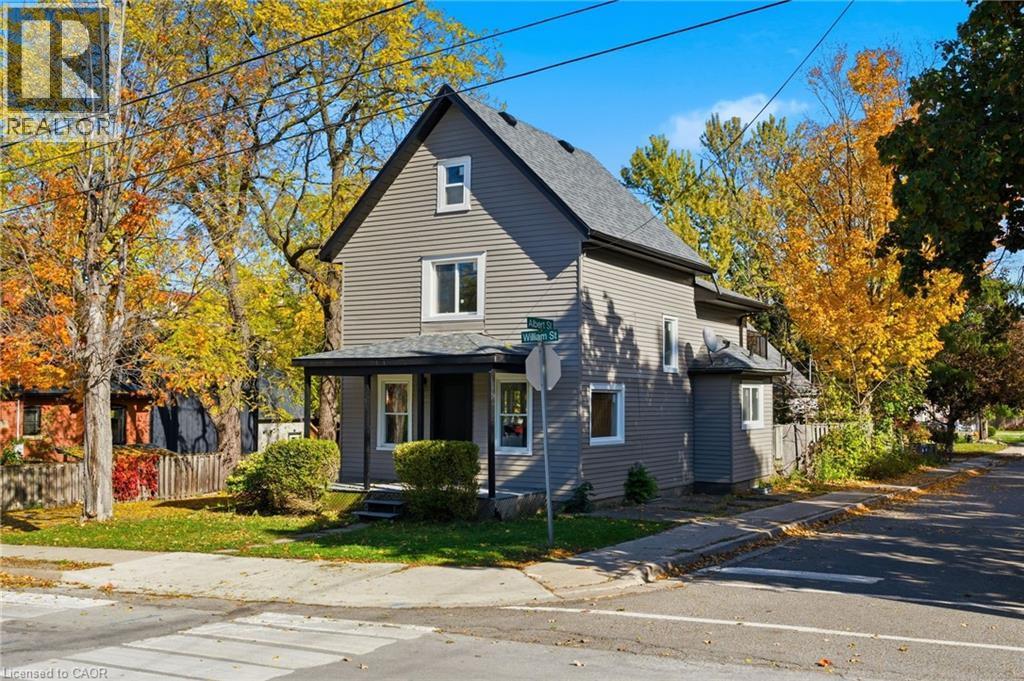 View of side of home with a shingled roof and a porch - 4255 William Street, Beamsville, ON - Outdoor With Facade