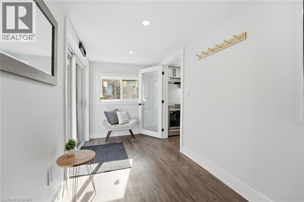 Hallway with dark wood finished floors and recessed lighting - 4255 William Street, Beamsville, ON - Indoor Photo Showing Other Room
