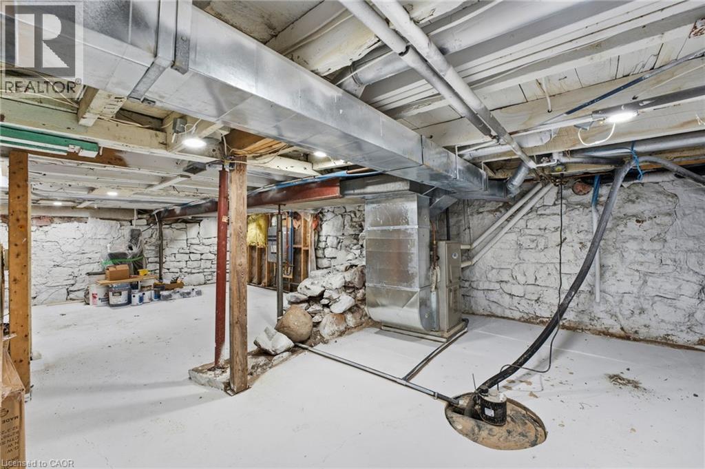 Unfinished below grade area with heating unit - 4255 William Street, Beamsville, ON - Indoor Photo Showing Basement