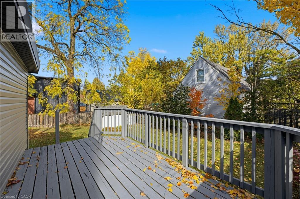 Wooden terrace featuring view of wooded area - 4255 William Street, Beamsville, ON - Outdoor With Deck Patio Veranda