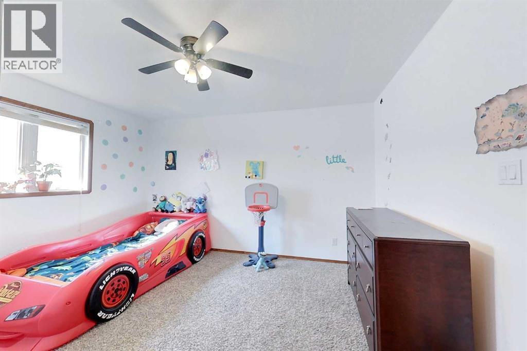 23 Springwood Drive Ne, Slave Lake, AB - Indoor Photo Showing Bedroom
