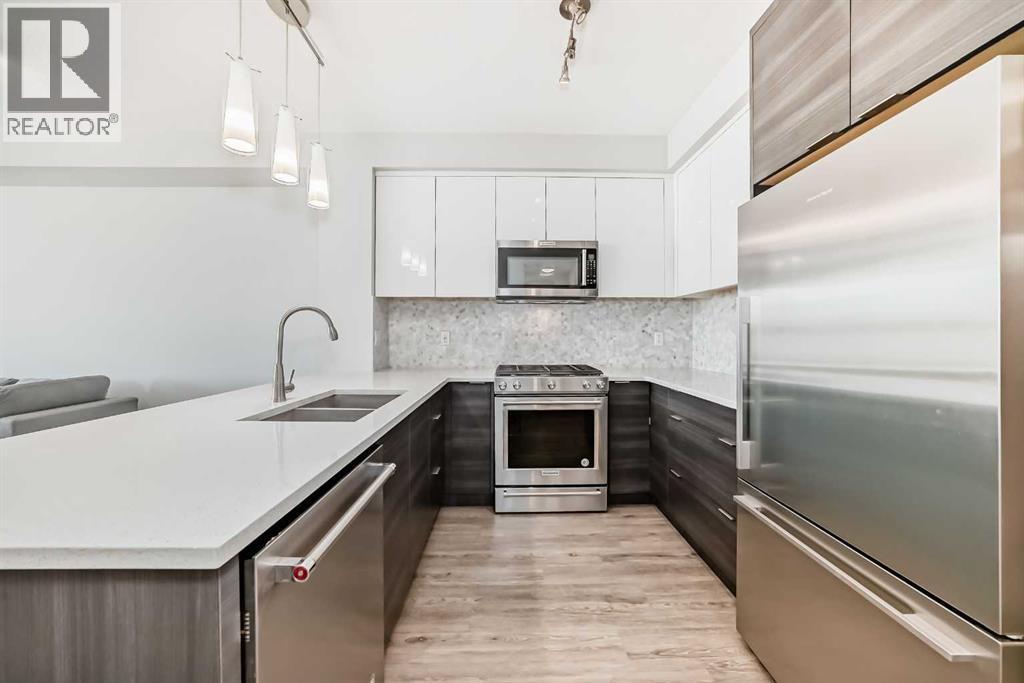 3210, 95 Burma Star Road Sw, Calgary, AB - Indoor Photo Showing Kitchen With Stainless Steel Kitchen With Double Sink With Upgraded Kitchen