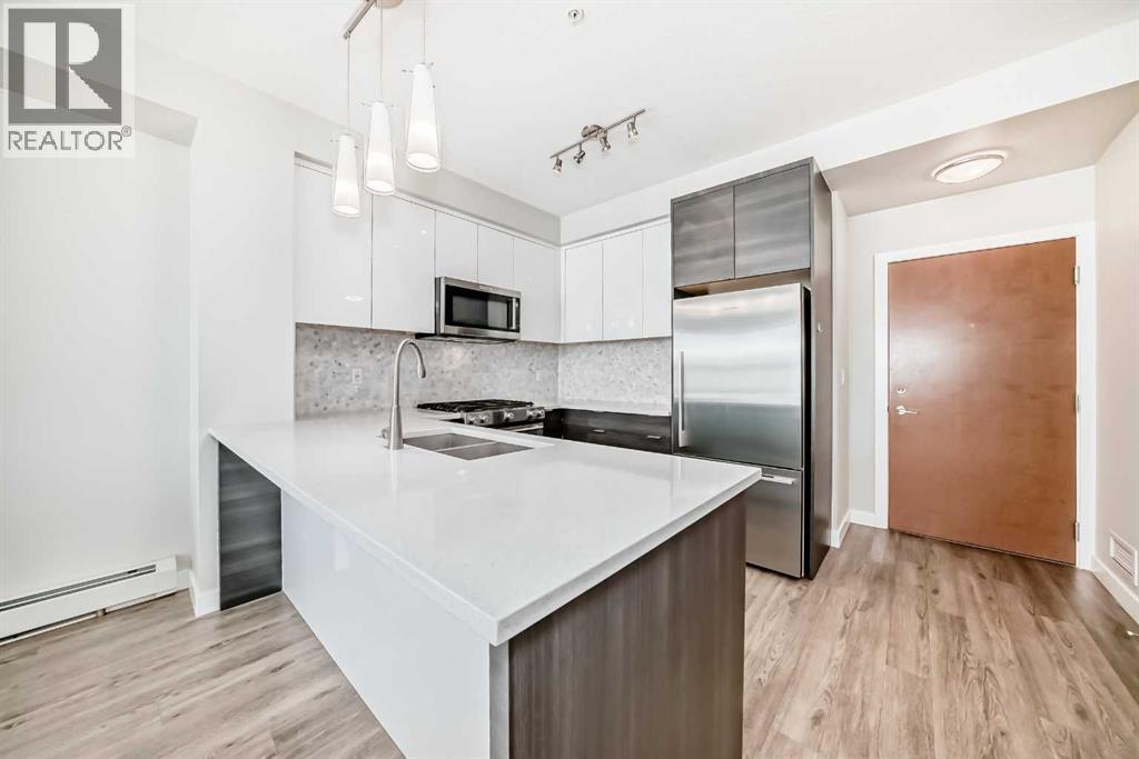 3210, 95 Burma Star Road Sw, Calgary, AB - Indoor Photo Showing Kitchen With Stainless Steel Kitchen With Double Sink With Upgraded Kitchen