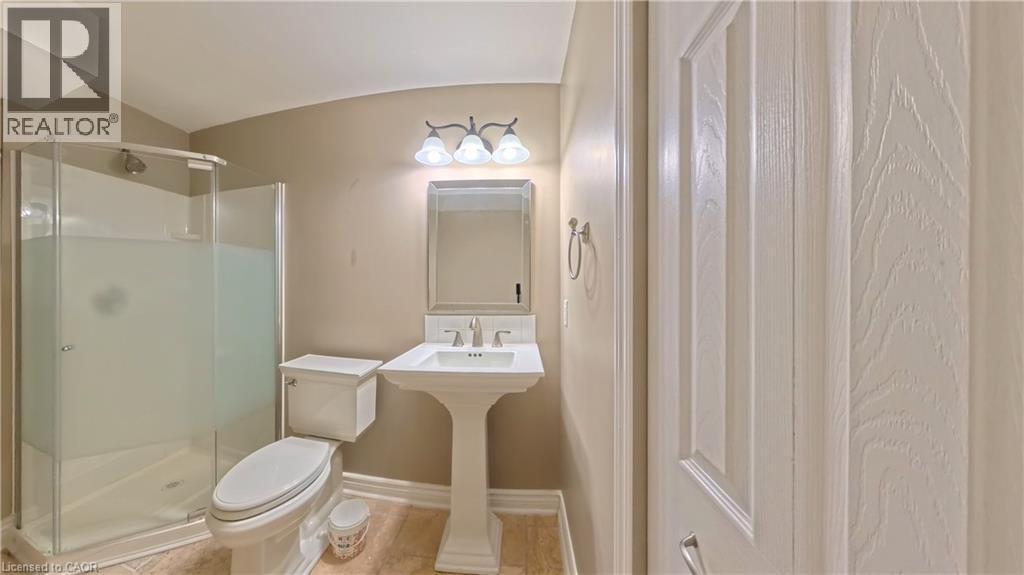 Bathroom with a shower stall and tile patterned flooring - 919 Zeller Crescent, Kitchener, ON - Indoor Photo Showing Bathroom