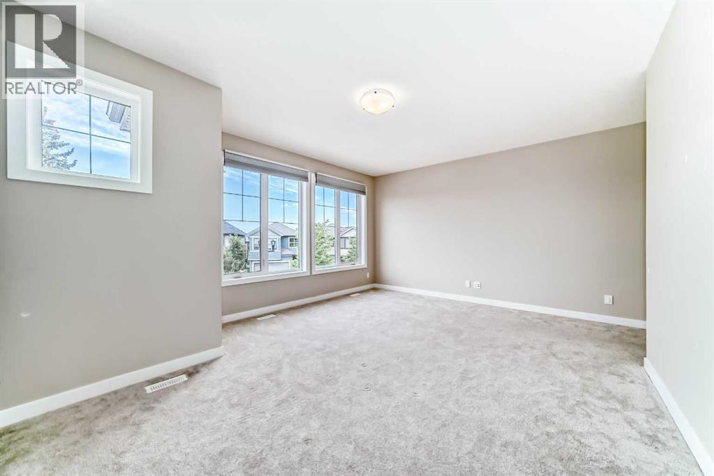 41 Shawnee Green Sw, Calgary, AB - Indoor Photo Showing Other Room