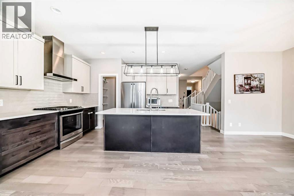 41 Shawnee Green Sw, Calgary, AB - Indoor Photo Showing Kitchen With Stainless Steel Kitchen With Upgraded Kitchen