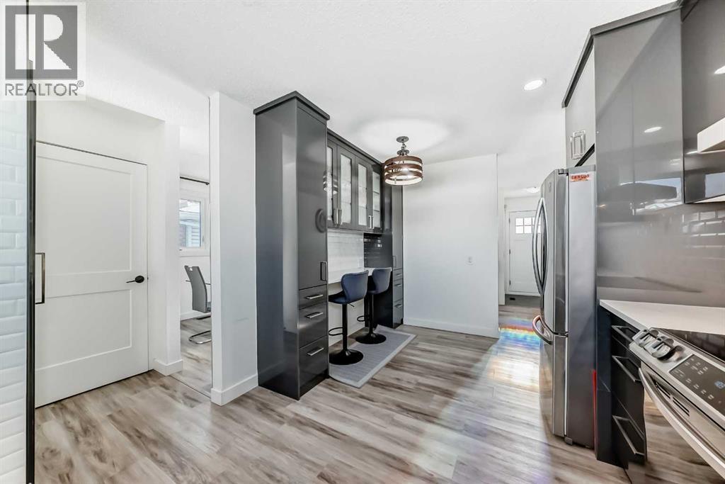 Kitchen access to front living room or dining room or to the basement - 216 Pinecrest Crescent Ne, Calgary, AB - Indoor Photo Showing Other Room