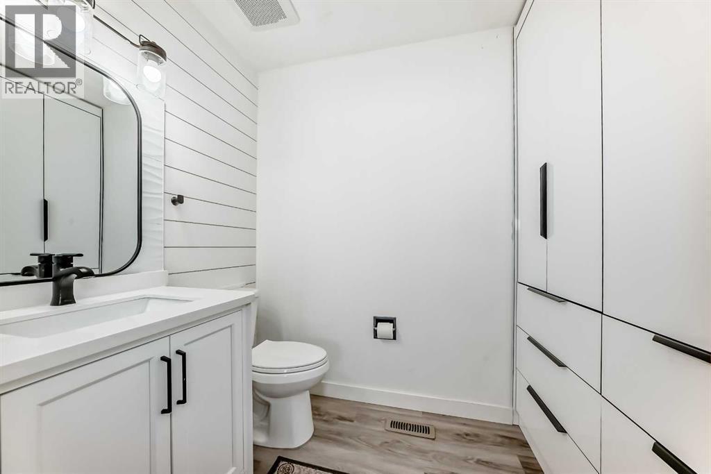 2 pc ensuite bath with built in closet - 216 Pinecrest Crescent Ne, Calgary, AB - Indoor Photo Showing Bathroom