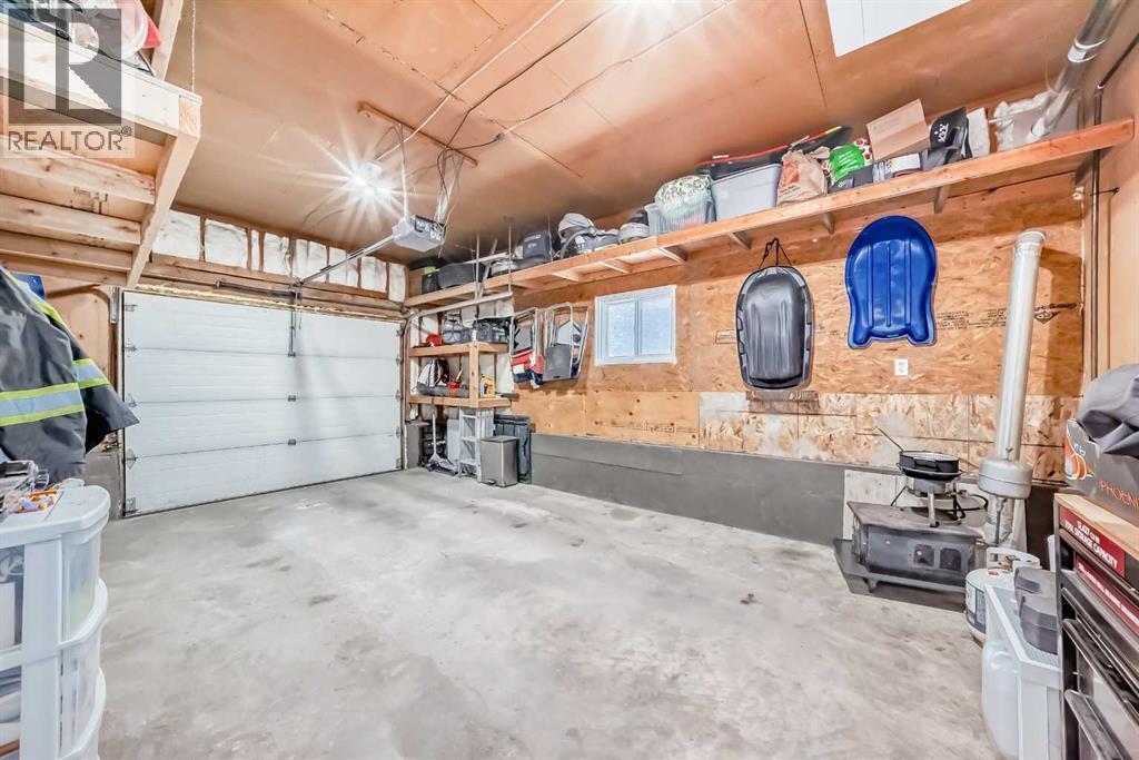 Single Attached Heated Garage - 216 Pinecrest Crescent Ne, Calgary, AB - Indoor Photo Showing Garage