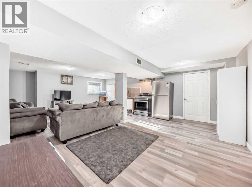 Great room and kitchen area of Legal 1 BR Suite - 216 Pinecrest Crescent Ne, Calgary, AB - Indoor Photo Showing Other Room