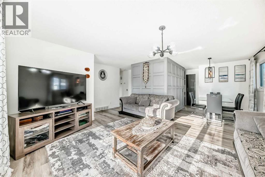 Main floor living room - 216 Pinecrest Crescent Ne, Calgary, AB - Indoor Photo Showing Living Room