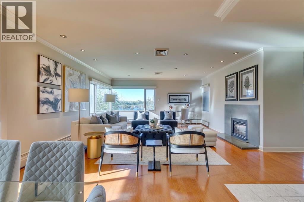 3N, 222 Eagle Ridge Drive Sw, Calgary, AB - Indoor Photo Showing Living Room With Fireplace