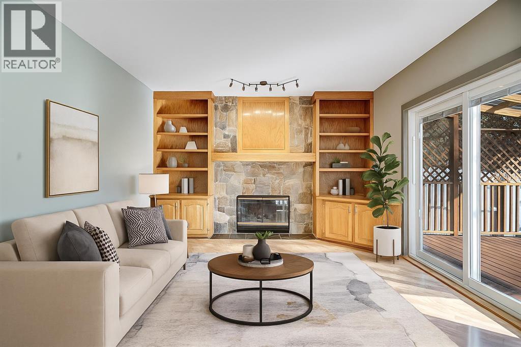107 Wood Valley Drive Sw, Calgary, AB - Indoor Photo Showing Living Room With Fireplace