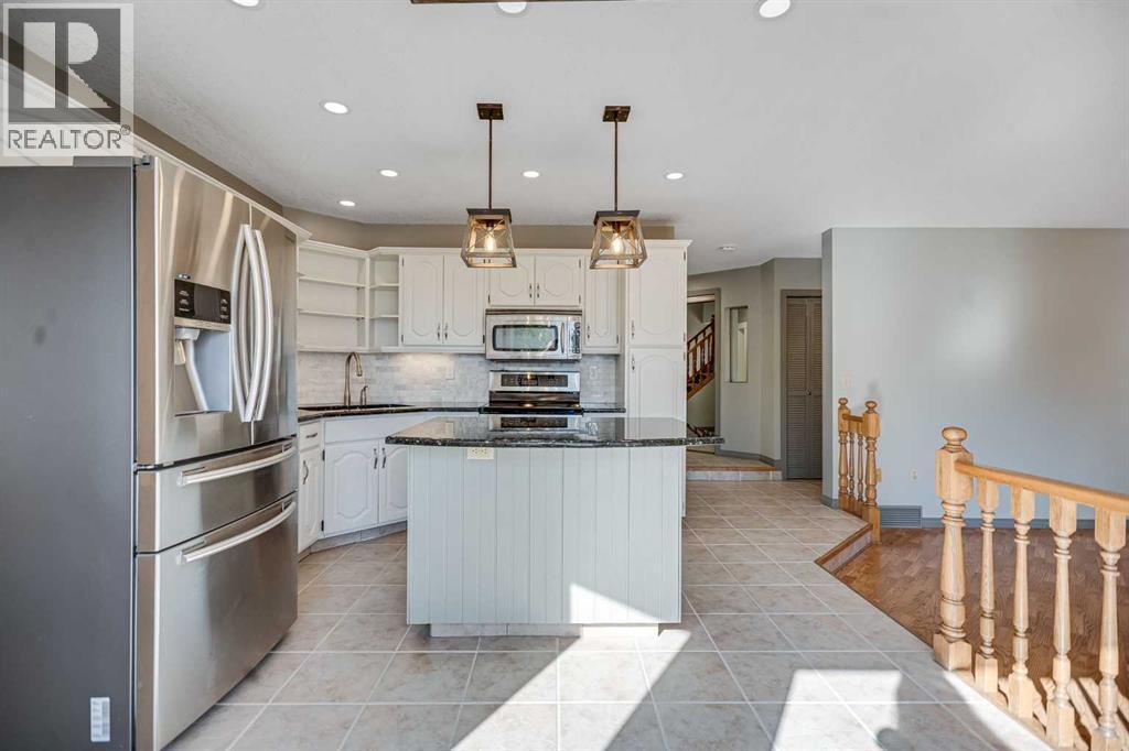 107 Wood Valley Drive Sw, Calgary, AB - Indoor Photo Showing Kitchen With Upgraded Kitchen