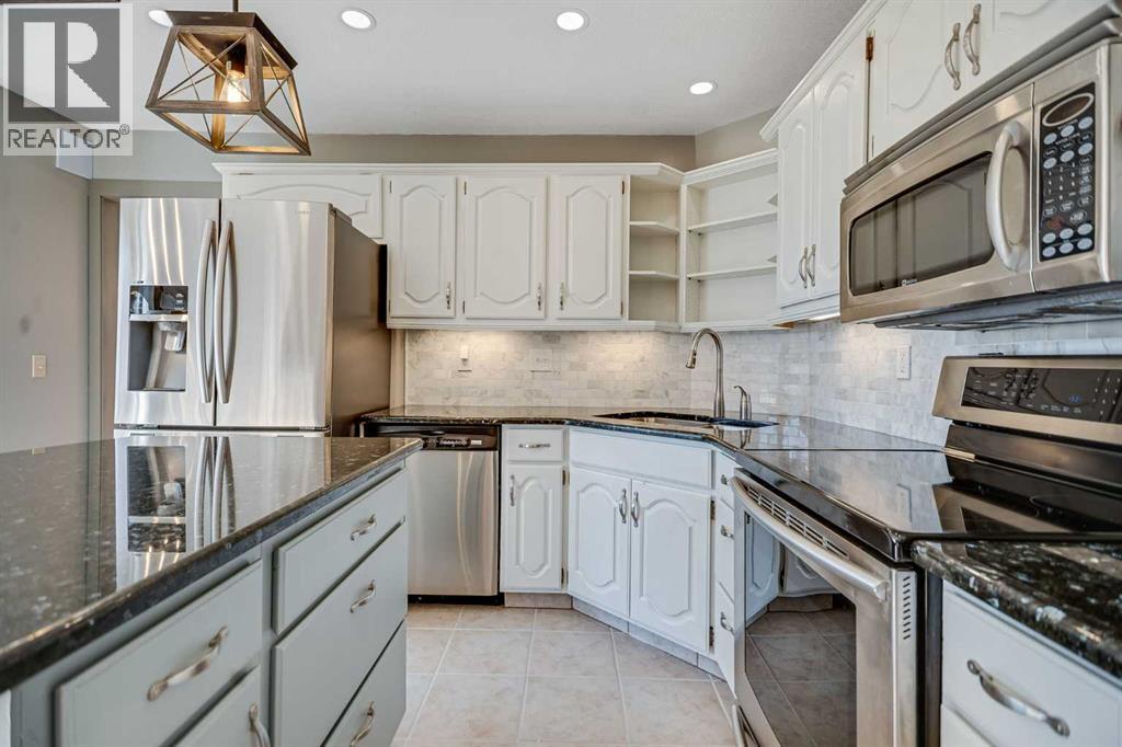107 Wood Valley Drive Sw, Calgary, AB - Indoor Photo Showing Kitchen With Stainless Steel Kitchen With Upgraded Kitchen