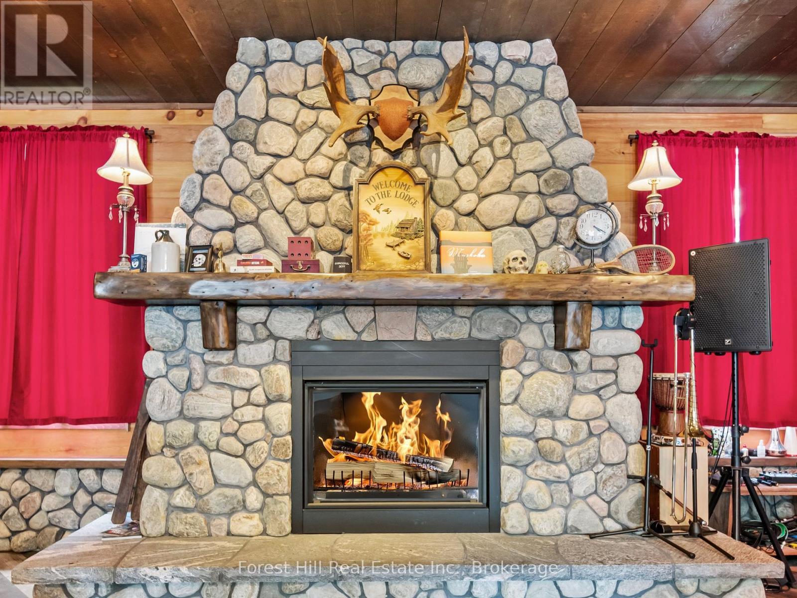 1326 Kawagama Lake Road, Algonquin Highlands (Sherborne), ON - Indoor Photo Showing Living Room With Fireplace