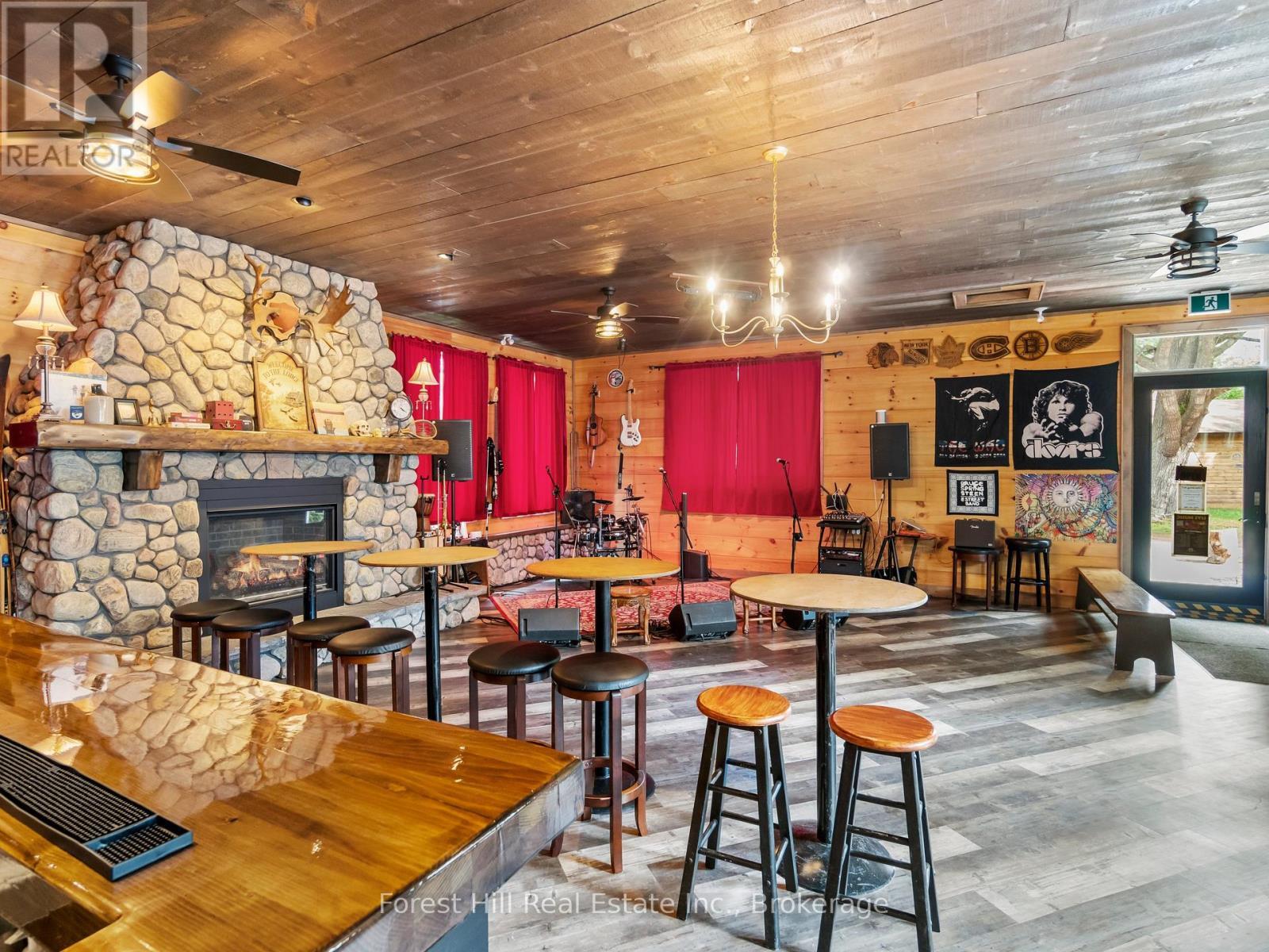 1326 Kawagama Lake Road, Algonquin Highlands (Sherborne), ON - Indoor Photo Showing Dining Room With Fireplace