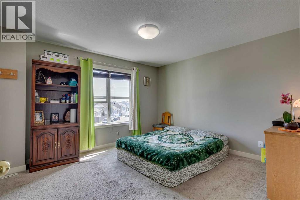 43 Sunrise Crescent Ne, High River, AB - Indoor Photo Showing Bedroom