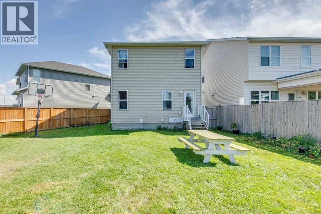 Summer Time Backyard - 43 Sunrise Crescent Ne, High River, AB - Outdoor With Exterior