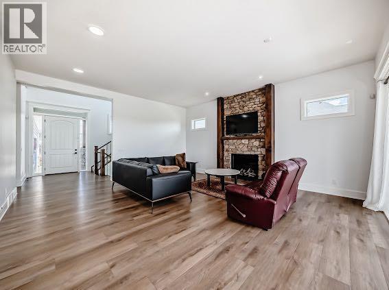 60 Junegrass Terrace, Rural Rocky View County, AB - Indoor Photo Showing Living Room With Fireplace