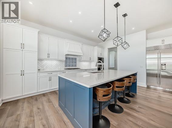 60 Junegrass Terrace, Rural Rocky View County, AB - Indoor Photo Showing Kitchen With Upgraded Kitchen