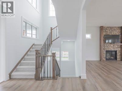 60 Junegrass Terrace, Rural Rocky View County, AB - Indoor Photo Showing Other Room With Fireplace