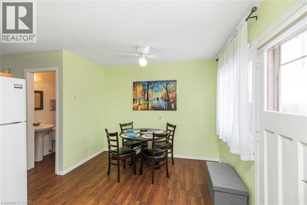 Dining area with dark wood-type flooring and a ceiling fan - 48 Riverdale Drive Unit# 2, Hamilton, ON - Indoor Photo Showing Dining Room