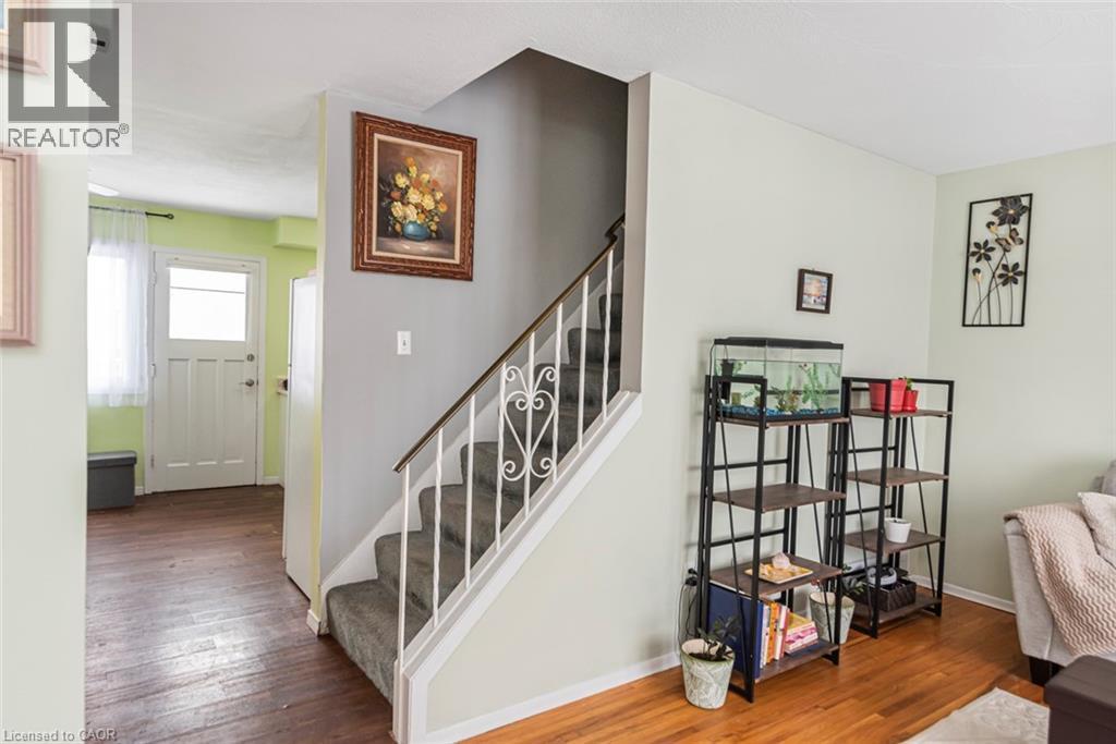 Stairs with wood-type flooring and baseboards - 48 Riverdale Drive Unit# 2, Hamilton, ON - Indoor Photo Showing Other Room