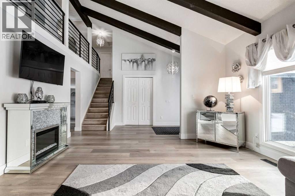 16 Woodgate Close Sw, Calgary, AB - Indoor With Fireplace