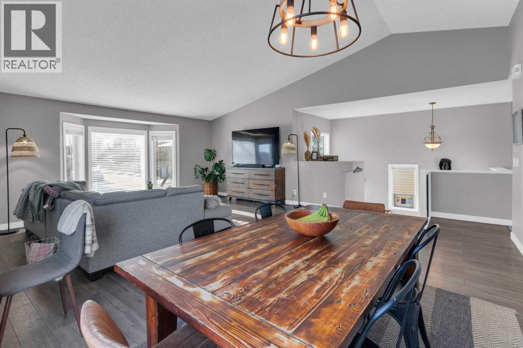 VAULTED CEILINGS - 40 Hunters Gate, Okotoks, AB - Indoor Photo Showing Dining Room