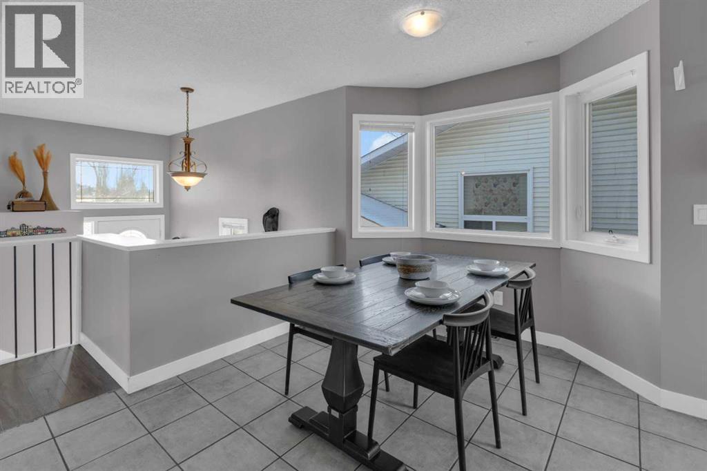 NOOK - 40 Hunters Gate, Okotoks, AB - Indoor Photo Showing Dining Room