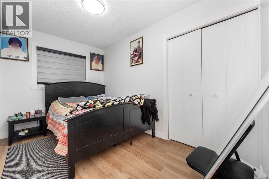 133 Woodbrook Road Sw, Calgary, AB - Indoor Photo Showing Bedroom