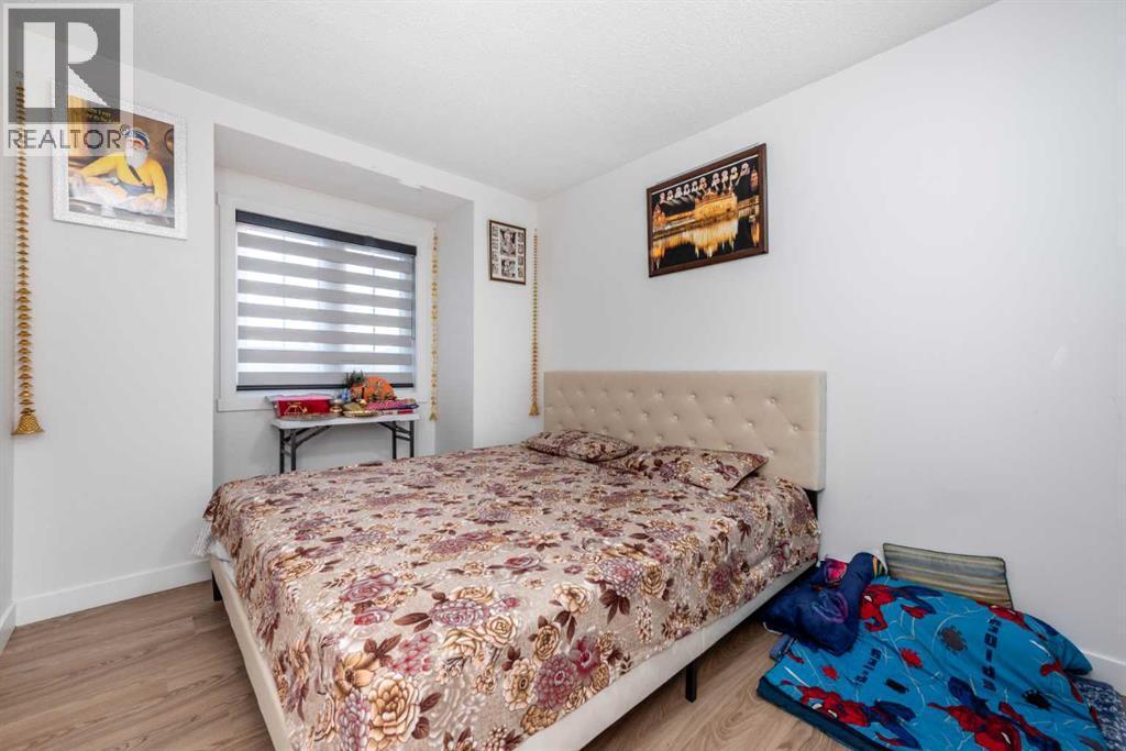 133 Woodbrook Road Sw, Calgary, AB - Indoor Photo Showing Bedroom