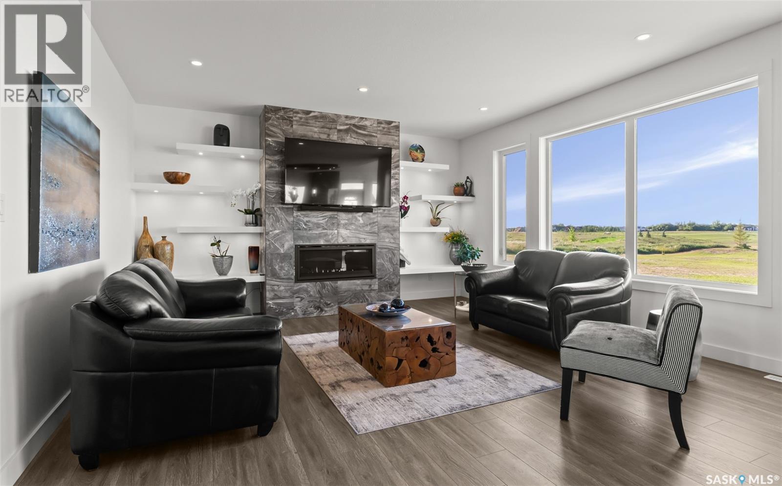 Grandview Trail, Corman Park Rm No. 344, SK - Indoor Photo Showing Living Room With Fireplace