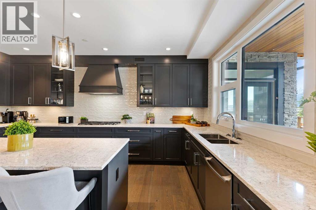 Kitchen - 102, 101A Stewart Creek Rise, Canmore, AB - Indoor Photo Showing Kitchen With Double Sink With Upgraded Kitchen