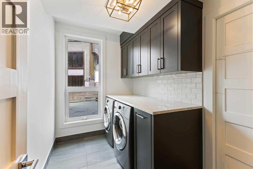 Laundry Room - 102, 101A Stewart Creek Rise, Canmore, AB - Indoor Photo Showing Laundry Room