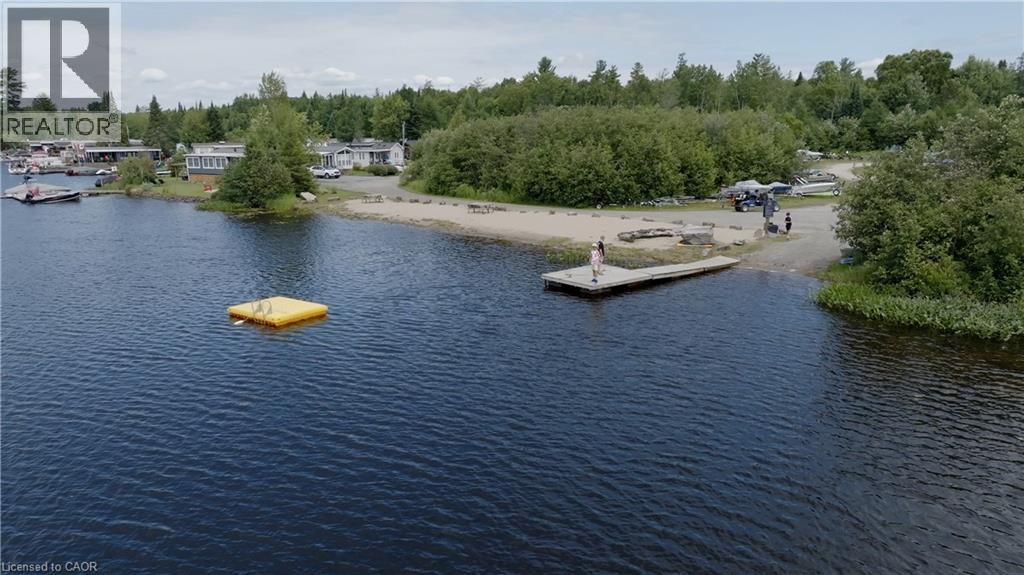 Water view with a floating dock - 85 Hutchinson Beach Road Unit# B56, Huntsville, ON - Outdoor With Body Of Water With View