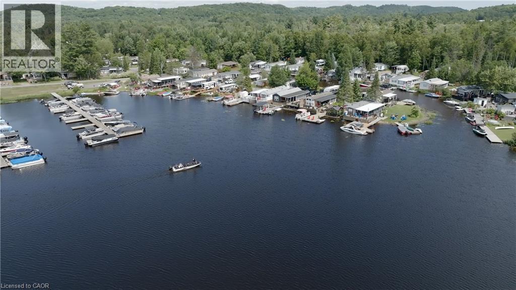 Water view with a forest - 85 Hutchinson Beach Road Unit# B56, Huntsville, ON - Outdoor With Body Of Water With View