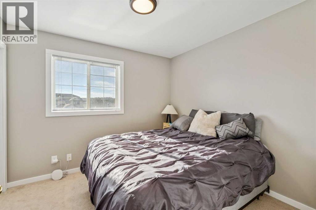 56 West Terrace Road, Cochrane, AB - Indoor Photo Showing Bedroom