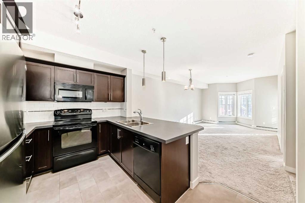 225, 20 Royal Oak Plaza Nw, Calgary, AB - Indoor Photo Showing Kitchen With Double Sink