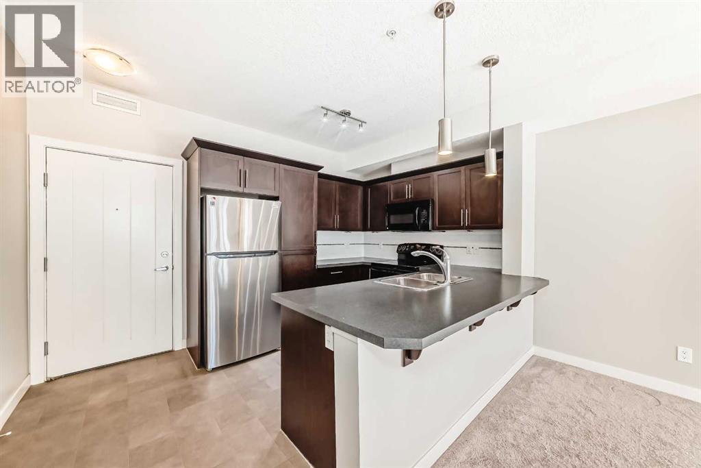 225, 20 Royal Oak Plaza Nw, Calgary, AB - Indoor Photo Showing Kitchen With Stainless Steel Kitchen With Double Sink