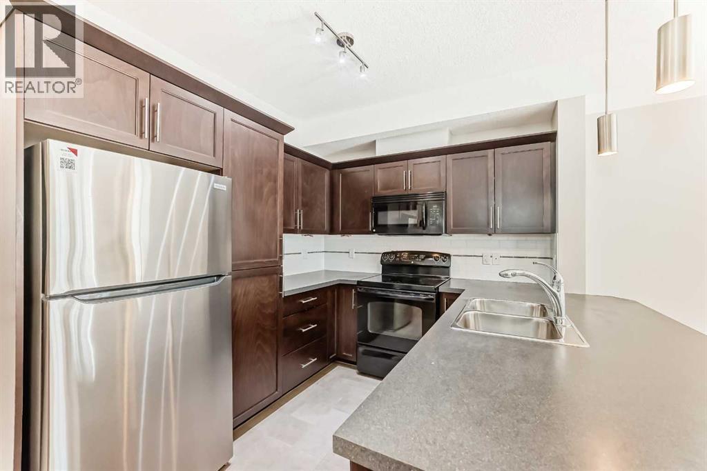 225, 20 Royal Oak Plaza Nw, Calgary, AB - Indoor Photo Showing Kitchen With Stainless Steel Kitchen With Double Sink