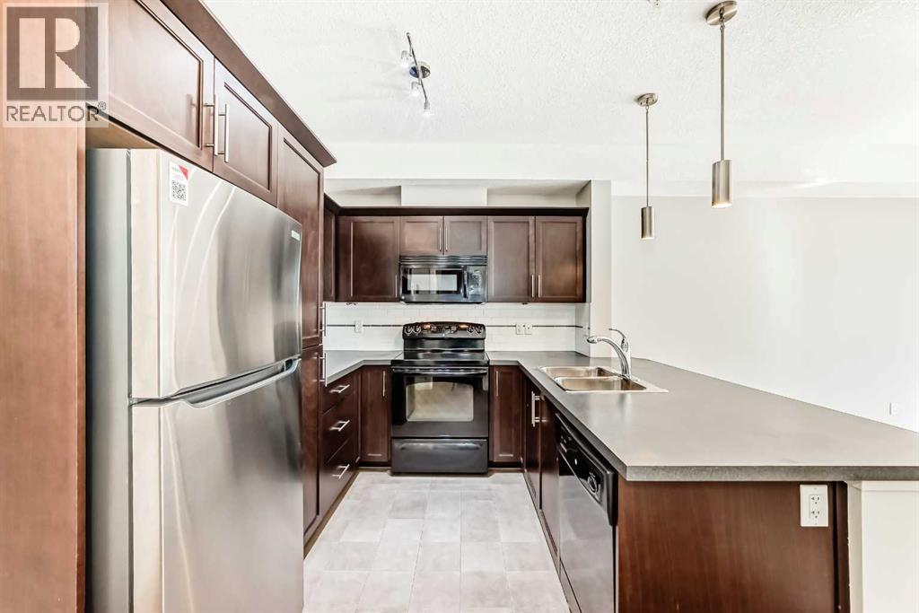 225, 20 Royal Oak Plaza Nw, Calgary, AB - Indoor Photo Showing Kitchen With Stainless Steel Kitchen With Double Sink