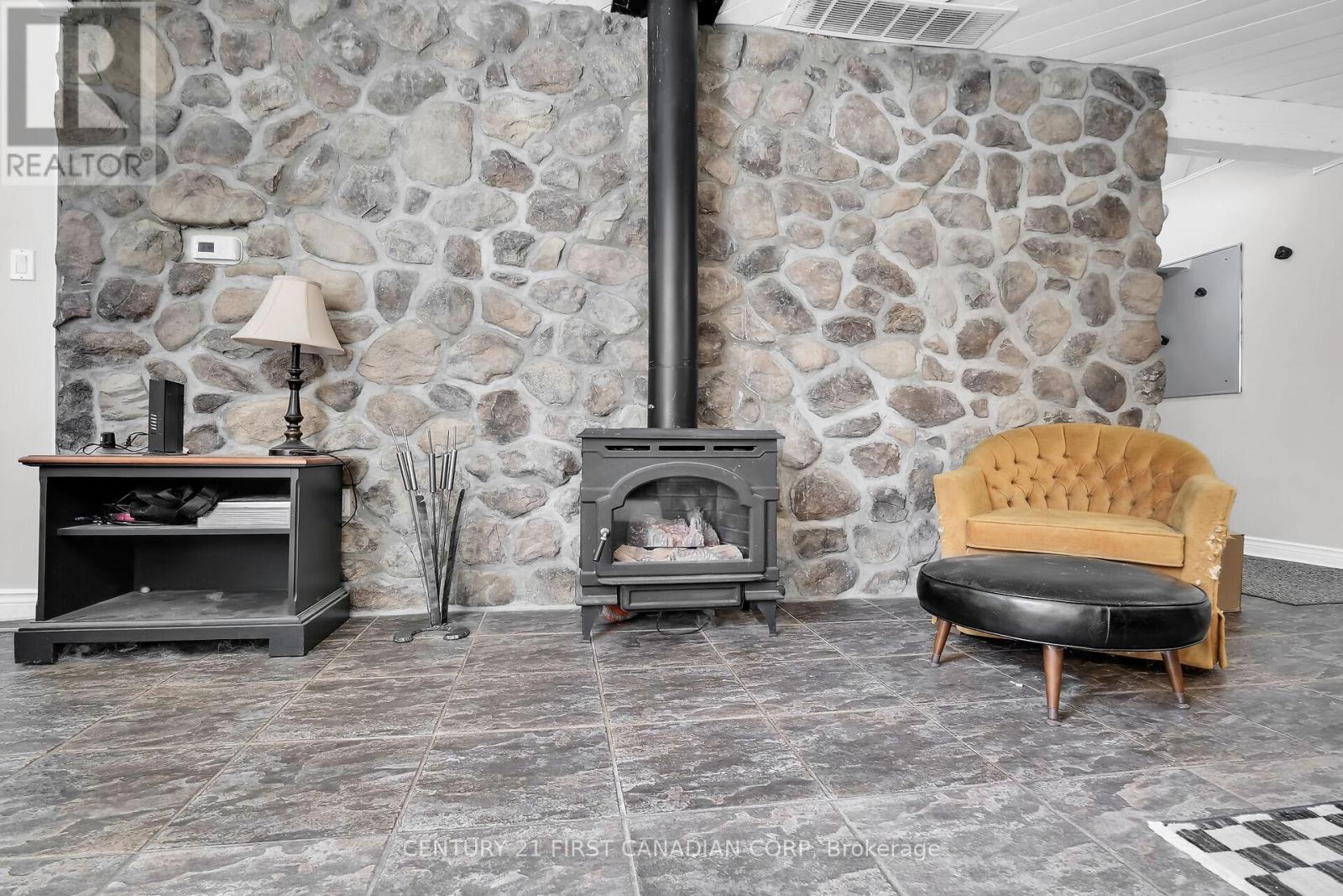 23992 Denfield Road, Middlesex Centre (Denfield), ON - Indoor With Fireplace