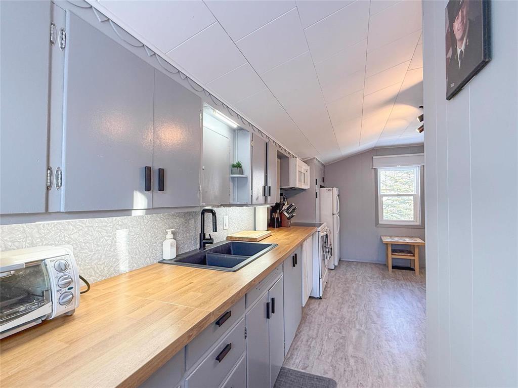 310 Commercial Street, Wawanesa, MB - Indoor Photo Showing Kitchen With Double Sink