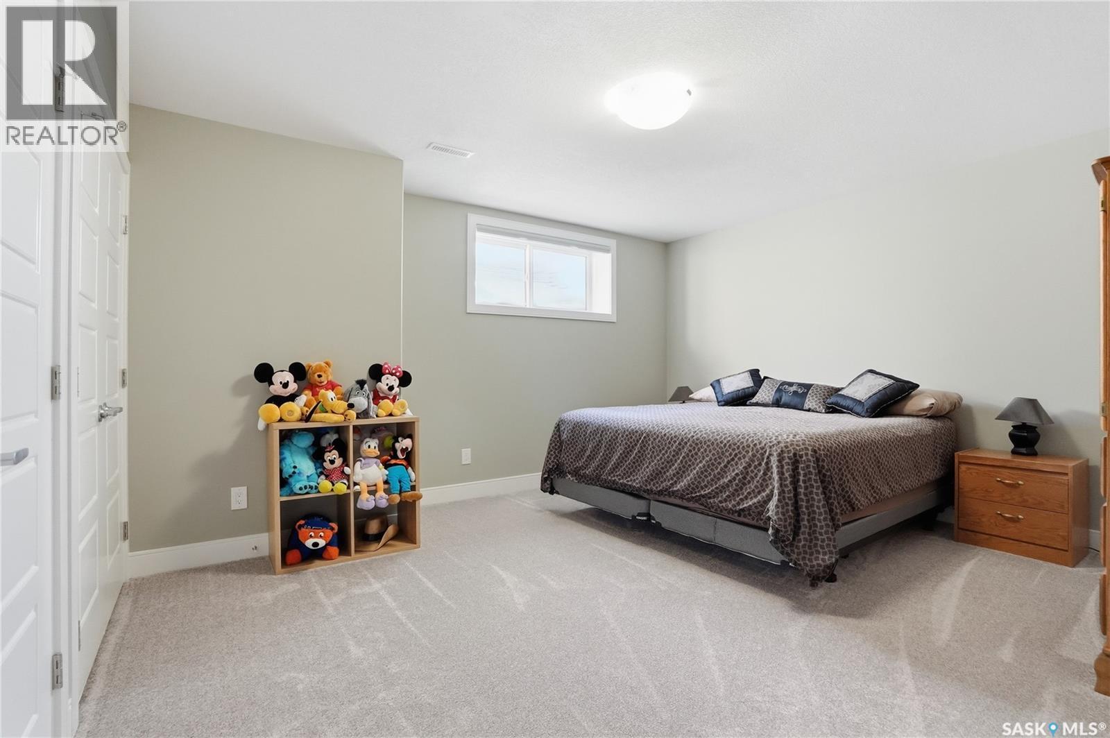 2 433 Palmer Crescent, Warman, SK - Indoor Photo Showing Bedroom