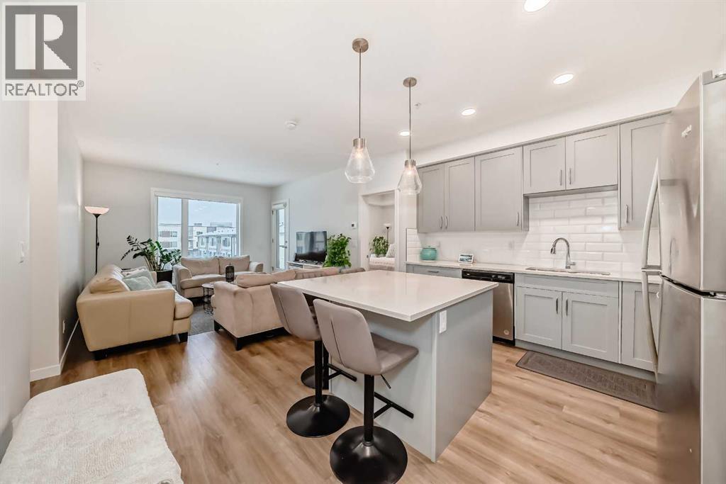 316, 200 Shawnee Square Sw, Calgary, AB - Indoor Photo Showing Kitchen With Stainless Steel Kitchen With Upgraded Kitchen