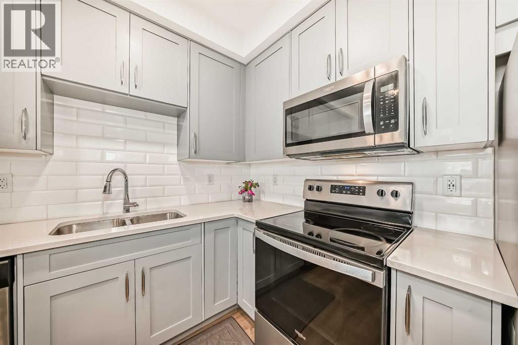 316, 200 Shawnee Square Sw, Calgary, AB - Indoor Photo Showing Kitchen With Double Sink With Upgraded Kitchen