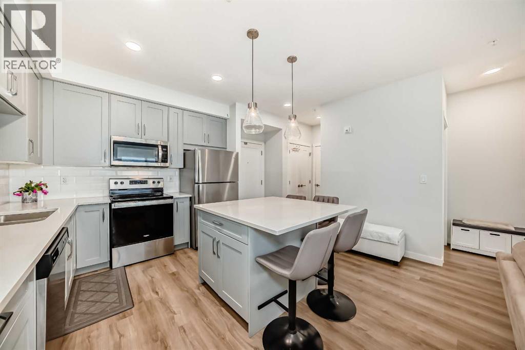 316, 200 Shawnee Square Sw, Calgary, AB - Indoor Photo Showing Kitchen With Stainless Steel Kitchen With Upgraded Kitchen